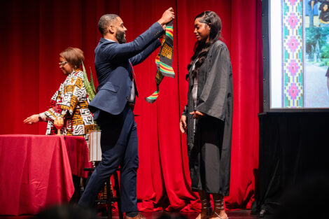 A student gets a stole at the Donning of the Kente