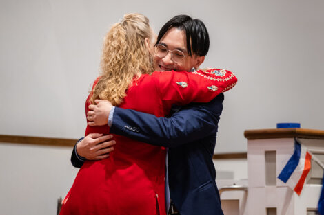 A student hugs a staff member at International Celebration