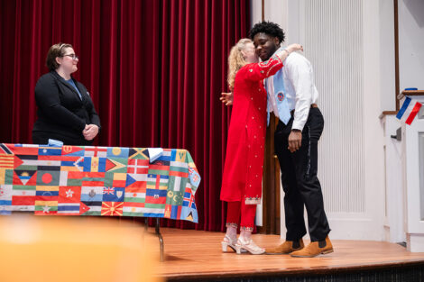 A student gets their stole at the international celebration.