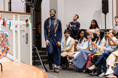 A student gets their stole at the international celebration.