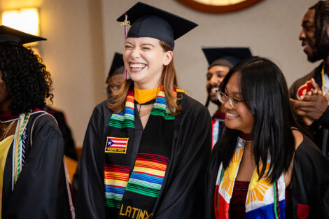 A student laughs during the Posse Celebration