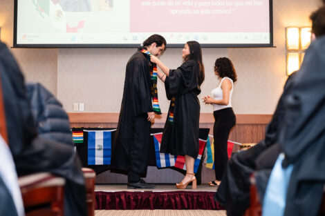 A student gets a stole at the Unidos en Celebración