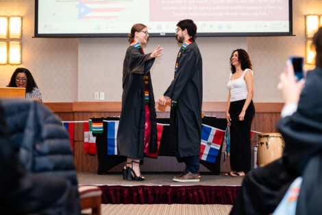A student gets a stole at the Unidos en Celebración