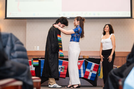 A student gets a stole at the Unidos en Celebración