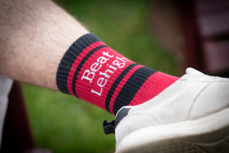A close up photo of a red and white sock that reads 