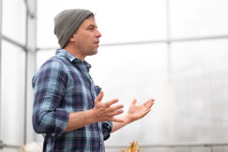 Owen Taylor of Truelove Seeds discusses food sources and demonstrates how to shell seed pods. | Photo by Adam Atkinson