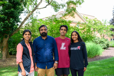 A family smiles during Lafayette College's fall 2025 move-in and orientation