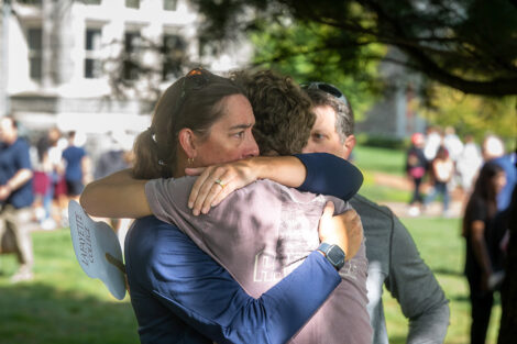 Family members hug during Lafayette College's move in weekend.