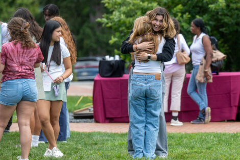 Two students hug each other on Lafayette College's Quad.