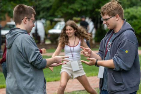 Students participate in outdoor games with their LEOS.
