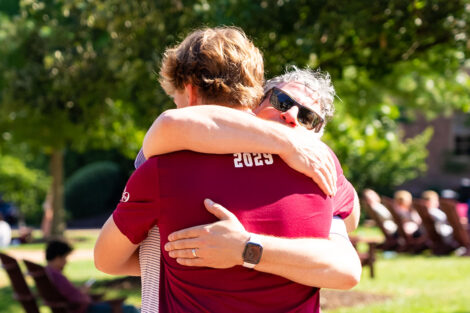 Family members hug during Lafayette College's move in weekend.