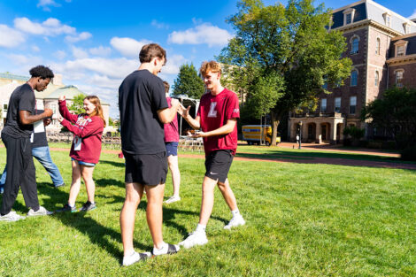 Students participate in outdoor games with their LEOS.
