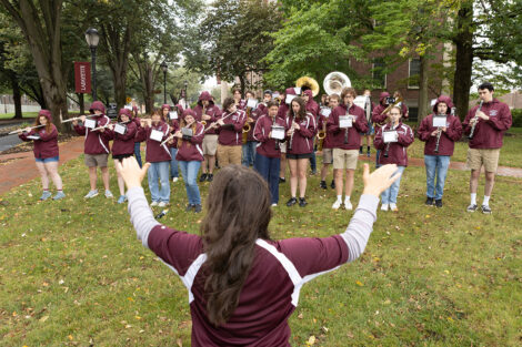 A conductor leads a band.