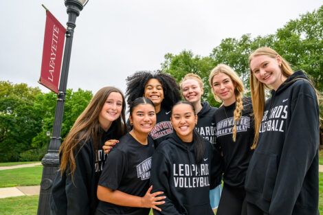 Students from the Lafayette College Volleyball team smile.