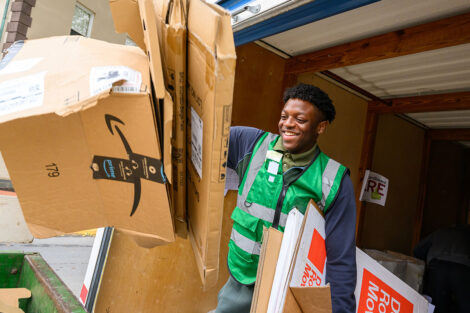 A student gathers cardboard boxes during Green Move-in