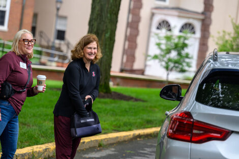 President Nicole Hurd and Sarah Moschenross give out water bottles.