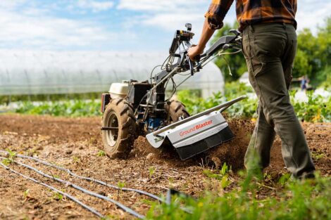 Closeup of dirtblaster machine plowing a field on LaFarm