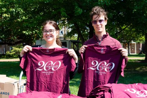 Lafayette community members posing with Bicentennial T-shirts