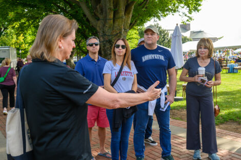 A family participates in a guided walking tour during the weekend.