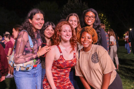 Students smile for a photo together.