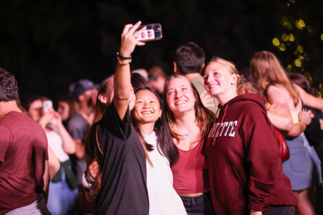 Students smile for a photo together.