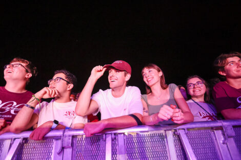 Students smile as they listen to a performance by Fitz and the Tantrums.