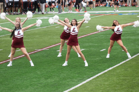 Cheerleaders perform on Fisher Field at Lafayette College.