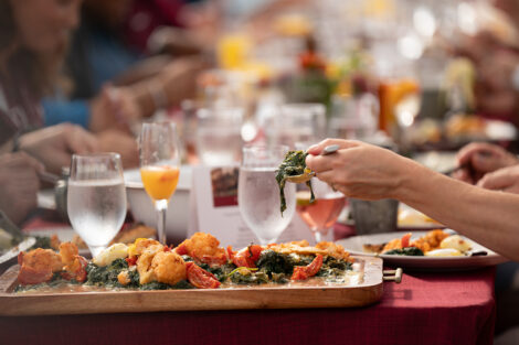 Close up photo of a wooden tray of roasted vegetables at the LaFarm to Table breakfast.