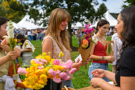 A student picks out beautiful flowers.
