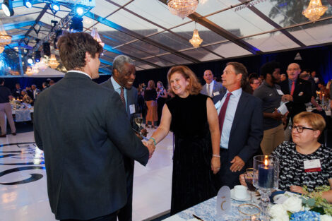 President Hurd is shaking hands with a guest.