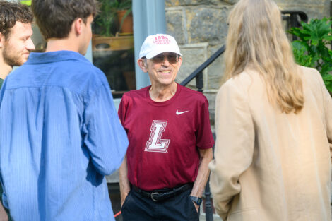 Students, alumni, and Lafayette College community members gather with coffee at McKelvy House.