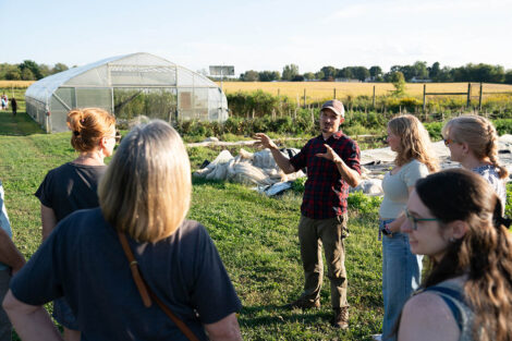Attendees listen to a presentation on sustainability at LaFarm.
