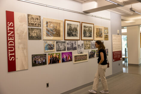 Lafayette community members observe artifacts of people at Lafayette College.