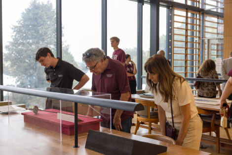 Lafayette community members observe artifacts of historical significance.