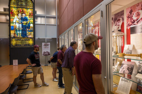 Lafayette community members observe artifacts of campus people throughout history.