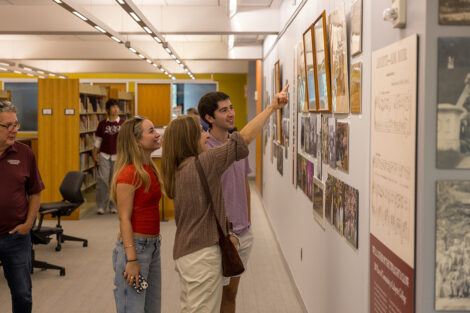 Lafayette community members observe artifacts of people at Lafayette.