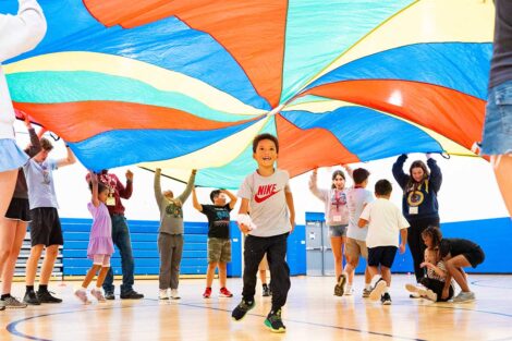 Lafayette POSP students and Paxinosa Elementary School students playing with a parachute