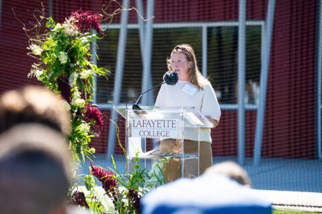 Head women's lacrosse coach Katie McConnell speaks during the dedication.
