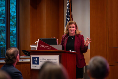 President Nicole Hurd speaks at a podium.