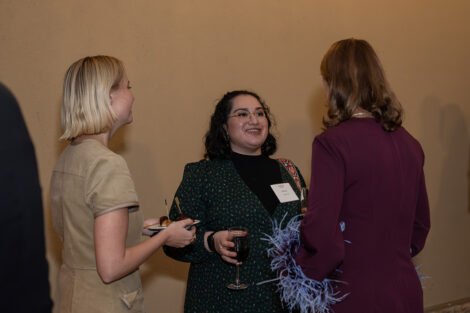 Guests talk to each other inside of the George Washington Presidential Library.