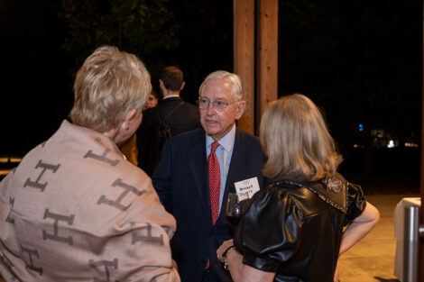 Guests talk to each other inside of the George Washington Presidential Library.