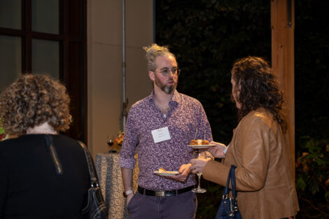 Guests talk to each other inside of the George Washington Presidential Library.