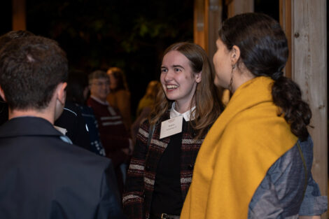Guests talk to each other inside of the George Washington Presidential Library.