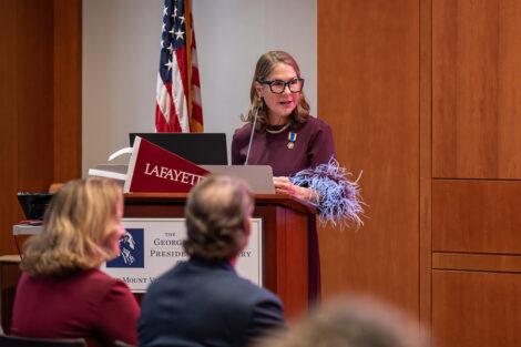 A speaker at the podium at the George Washington Presidential Library.