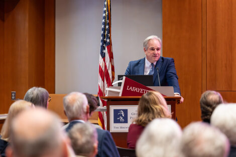 A speaker at the podium at the George Washington Presidential Library.