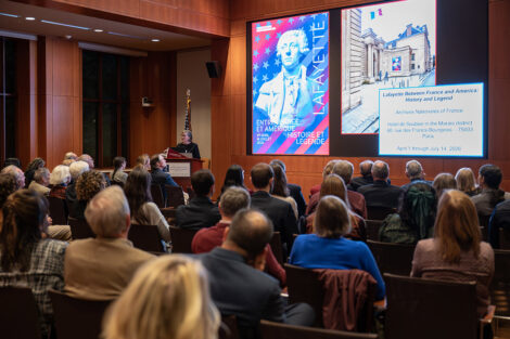 A speaker at the podium at the George Washington Presidential Library.