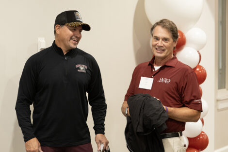 Bill Hurd and an alumni smile