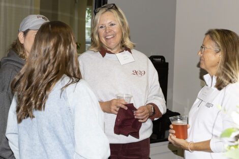 Alumni gather and talk