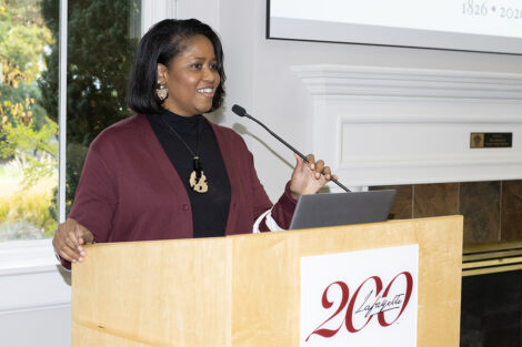 Sherryta Freeman speaks at a podium.