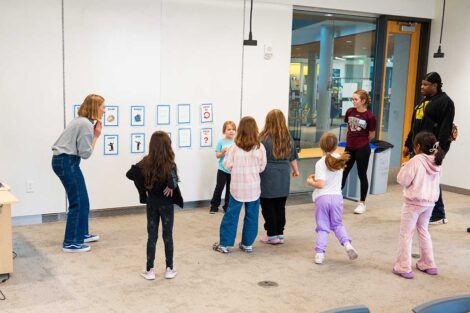 Girl Scouts and Lafayette faculty and staff dancing during an interactive Girl Scout Badge Day badge session
